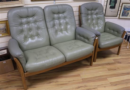 An Ercol sofa and chair, W.130cm